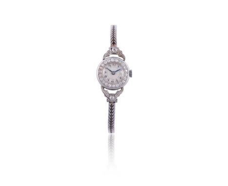 
	
		UNSIGNED
		LADY'S PRECIOUS WHITE METAL AND DIAMOND BRACELET WATCH, NO. 33188, CIRCA 1930
		Movement: Swiss manual wind
	