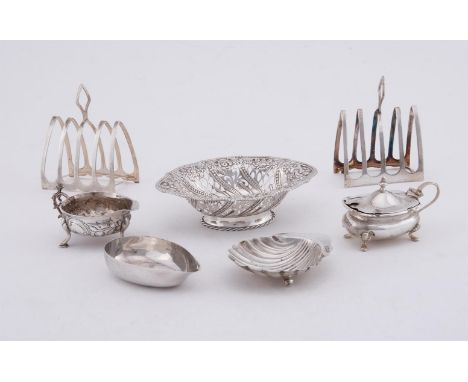 
	
		SEVEN ITEMS OF SMALL SILVER 
		Comprising: a pair of late Victorian four division toast racks by Harrison Brothers &amp;