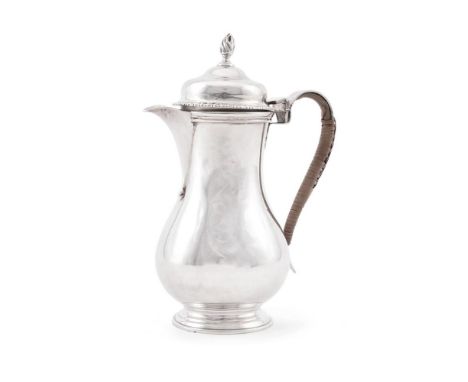 
	
		A LATE VICTORIAN SILVER BALUSTER COFFEE JUG 
		JAMES PARKES, LONDON 1901 
		With a flambeau finial to the ogee domed cov