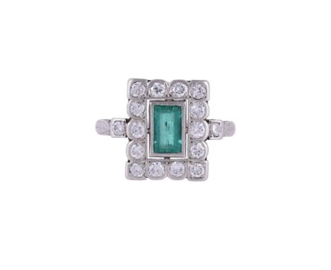 
	
		A 1920S EMERALD AND DIAMOND PANEL RING
		The rectangular panel with a central step cut emerald, within a surround of bri