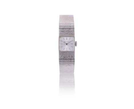 
	
		JEAN RENET
		LADY'S 9 CARAT WHITE GOLD BRACELET WATCH, NO. 01126, CIRCA 1967
		Movement: Manual wind, 17 jewels 
		Case: