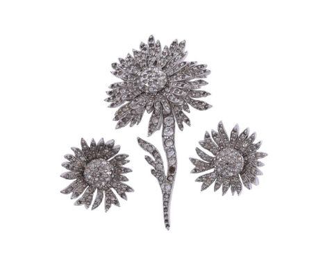
	
		CHRISTIAN DIOR, A SUITE OF WHITE PASTE FLOWER JEWELLERY BY MITCHEL MAER 
		CIRCA 1955
		The brooch with a swivelling flo