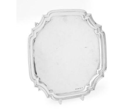 
	
		A SILVER SHAPED SQUARE SALVER 
		VINERS LTD, SHEFFIELD 1932 
		With inset curved angles, a moulded rim and on four scrol