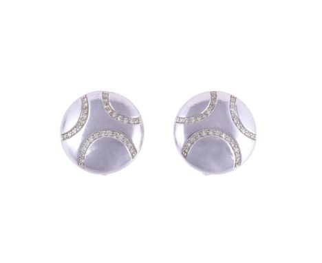 
	
		A PAIR OF 18 CARAT WHITE GOLD DISC EARRINGS 
		LONDON 2008
		The polished circular panels set with curves of brilliant c