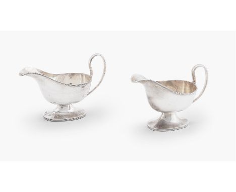 
	
		A PAIR OF SMALL SILVER SAUCE BOATS 
		WILLIAM HUTTON &amp; SONS, SHEFFIELD 1927 
		Oval, with high loop handles, threade