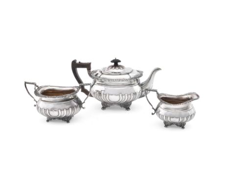 
	
		A MATCHED OBLONG BALUSTER THREE PIECE TEA SERVICE 
		THOMAS BRADBURY &amp; SONS, LONDON 1900 AND 1901  
		The tea pot wi