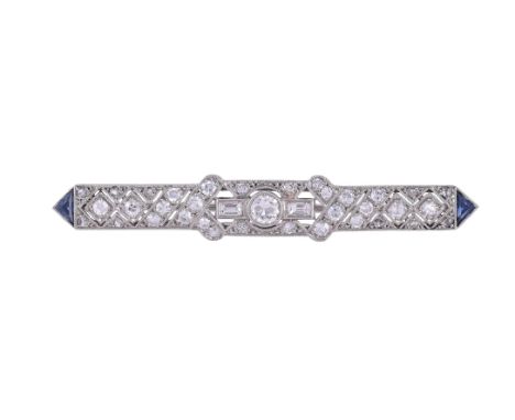 
	
		AN ART DECO DIAMOND AND SAPPHIRE BAR BROOCH
		The pierced geometric brooch millegrain set with eight cut, baguette cut, 