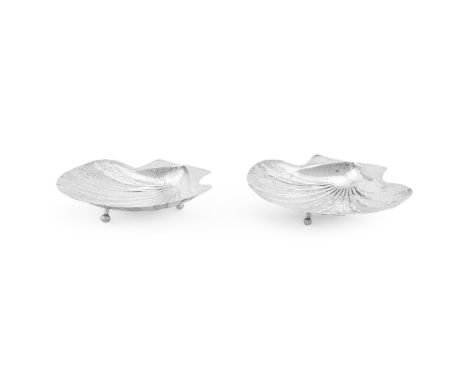 
	
		A PAIR OF COLOMBIAN SILVER COLOURED SHELL DISHES 
		STAMPED T.R.P, 20TH CENTURY 
		The striations alternately plain and 