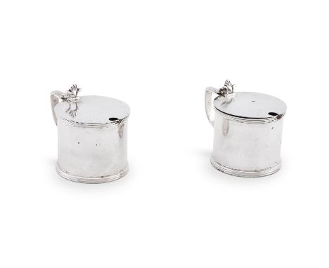 
	
		A PAIR OF SILVER DRUM MUSTARD POTS 
		MAKER'S MARKS RUBBED, LONDON 1919 
		Plain, the flat covers with openwork shell th