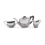 A MATCHED SILVER OVAL THREE PIECE TEA SERVICE, WILLIAMS (BIRMINGHAM) LTD AND H. V. PITHEY & CO.