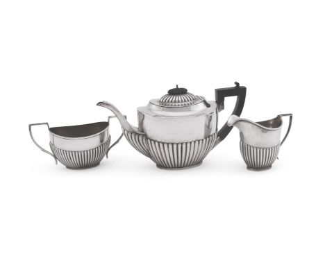 
	
		A MATCHED SILVER OVAL THREE PIECE TEA SERVICE 
		WILLIAMS (BIRMINGHAM) LTD AND H. V. PITHEY &amp; CO., BIRMINGHAM 1911 
