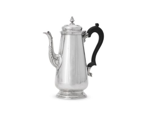 
	
		A SILVER TAPERED COFFEE POT IN GEORGE II STYLE 
		D. &amp; J. WELLBY LTD, LONDON 1919 
		With a bell finial to the doubl