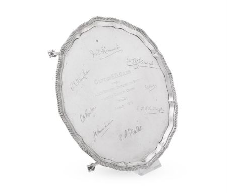 A SILVER SHAPED CIRCULAR SALVER 
THE GOLDSMITHS &amp; SILVERSMITHS CO. LTD, SHEFFIELD 1915 
With a raised gadrooned rim and o