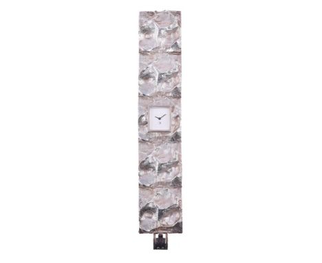 
	
		SIROKORU, FINLAND, A SILVER COLOURED BRACELET WATCH 
		CIRCA 1975
		The broad bracelet with textured undulating panels, 