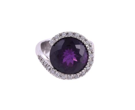 
	
		A DIAMOND AND AMETHYST DRESS RING
		The circular cut amethyst within a surround of brilliant cut diamonds, approximately