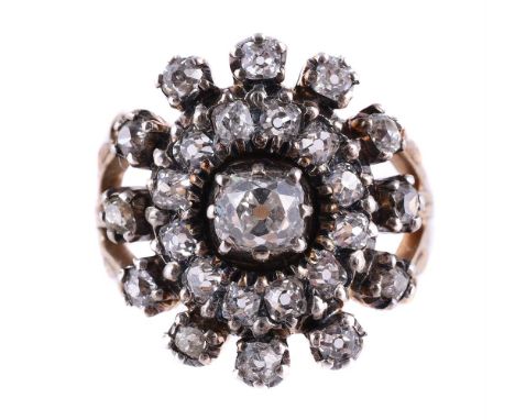 
	
		A DIAMOND SUNBURST CLUSTER RING
		The front panel set with a cluster of old cut diamonds, approximately 1.35 carats tota