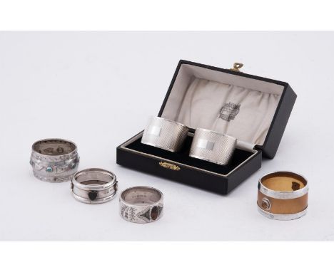 
	
		AN ARTS AND CRAFTS SILVER CYMRIC NAPKIN RING 
		LIBERTY &amp; CO., BIRMINGHAM 1903 
		With six turquoise cabochons and f