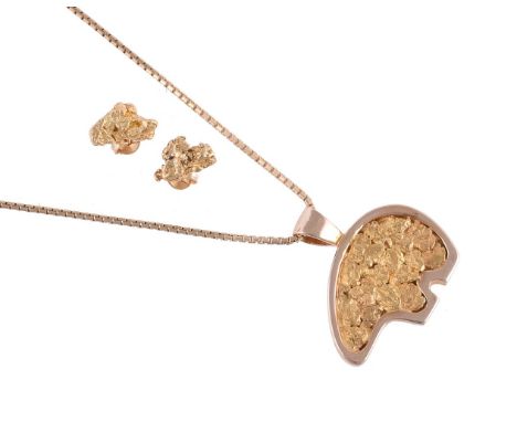 
	
		A GOLD COLOURED BEAR PENDANT AND NUGGET EAR STUDS
		The bear pendant with gold nugget style decoration, indistinctly sta