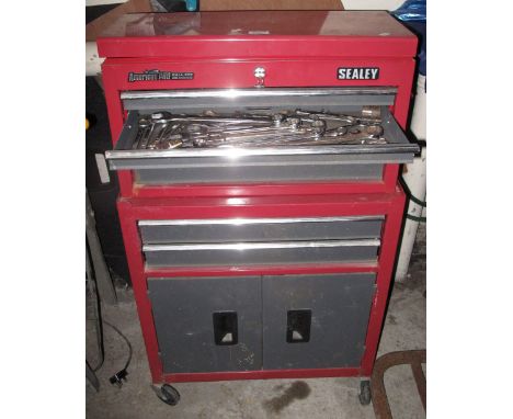 Sealey metal tool cabinet on wheels with various tools including pliers, screw drivers, spanners, drill bits etc.