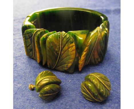 Green carved Bakelite bangle and earrings.