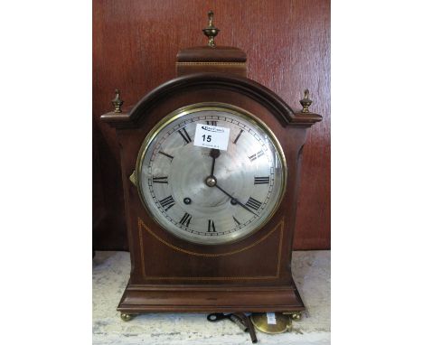 Edwardian inlaid mahogany two train bracket clock in Georgian style with silvered Roman face, key and pendulum.