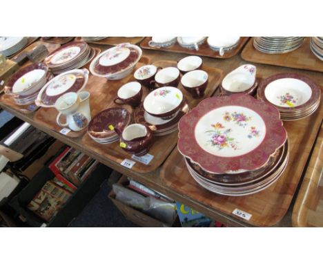 Four trays of Staffordshire 'Empire' porcelain teaware and other items on a gilt and burgundy ground with floral decoration c