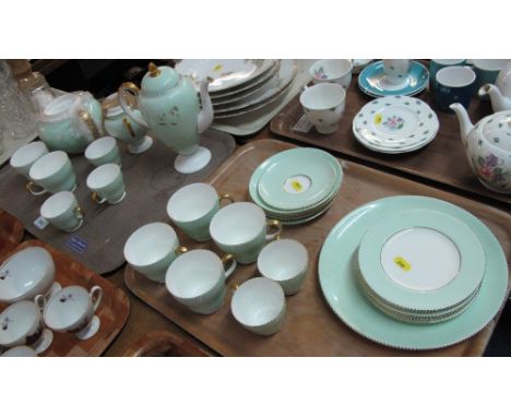 Two trays of Wedgwood bone china tea service on a pale green ground with gilt handles, comprising: teacups and saucers; plate