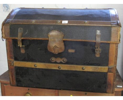 Vintage canvas dome topped trunk with wooden and leather mounts.