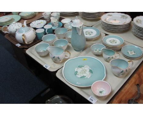 Three trays of Suzi Cooper bone china tea and coffee ware, various patterns including 'Gardenia', comprising teacups and sauc