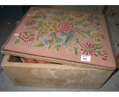 Wooden box with hinge lid decorated with floral tapestry work.