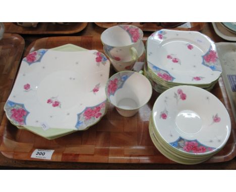 Tray of Shelley Art Deco design china part teaware on a white ground with flowers and foliage comprising: three cups; ten sau