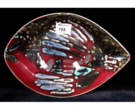 1970s Poole Pottery dark red ground boat shaped dish.  Printed marks.