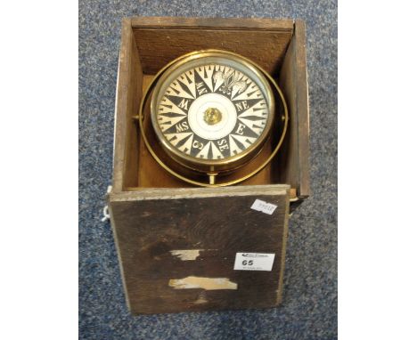 Brass gimballed ship's compass in original box. CONDITION REPORT: Compass appears good and revolves/spins, tarnishing and wea