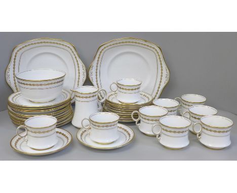 A Royal Albert 5430 tea service comprising two cake plates, twelve tea plates, eleven saucers, nine cups, (one with hairline 