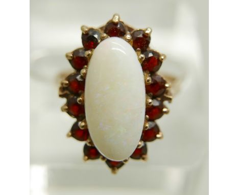 A 9ct gold, opal and garnet cluster ring, 3.9g, Q, opal 7mm x 15mm 