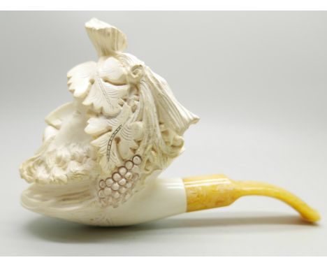 A large carved Meerschaum pipe of a Greek God, cased 