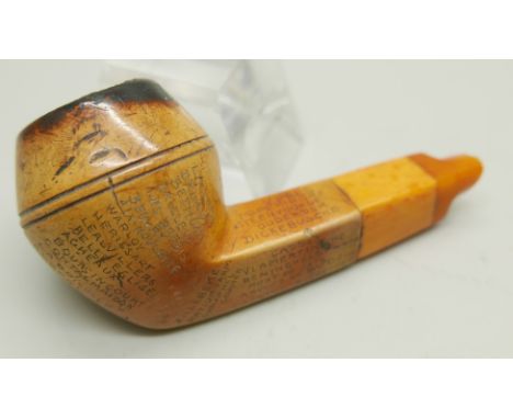 An early 20th Century Meerschaum pipe, missing end of amber stem, carved with fifty-two different locations in Northern Franc