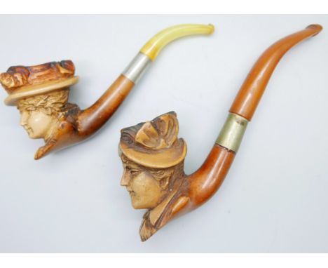A carved Meerschaum pipe of a Victorian lady, amber stem, cased and one other loose 