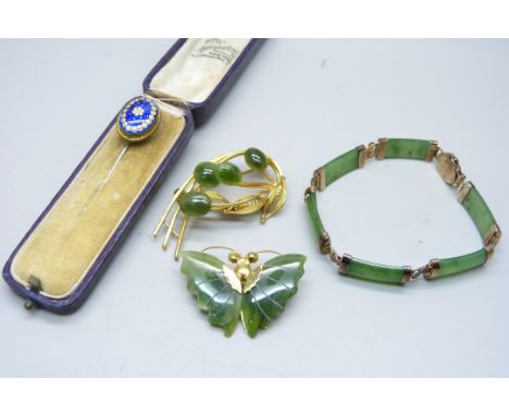 A silver set jade bracelet, two jade set brooches and an enamelled pin 