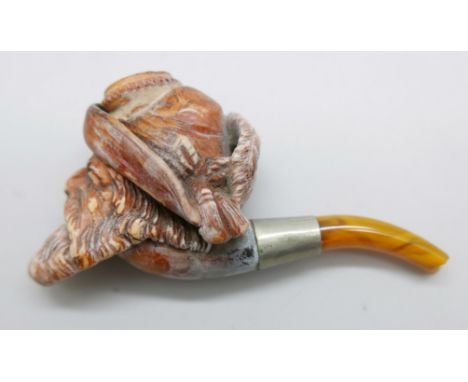 A 19th Century Meerschaum pipe with amber stem, Bavarian man with beard and hat with feather 