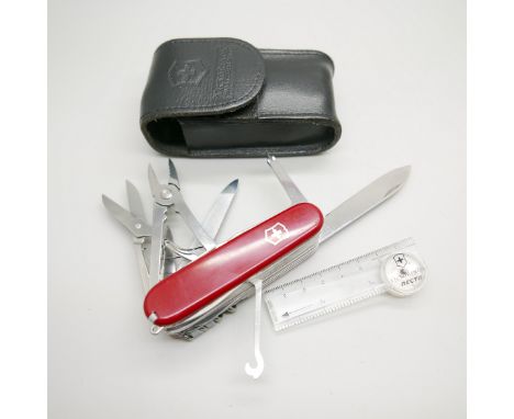 A Victorinox Swiss multi-tool knife, 22 tools and with a compass, with leather case 