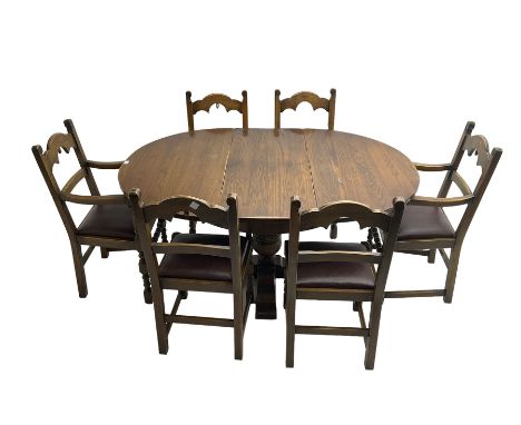 20th century oak circular extending dining table, splayed supports united by carved bulbous turned column on cross plinth bas