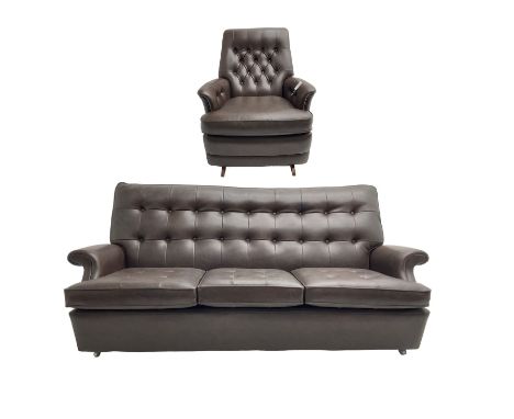 Parker Knoll - modernist three seater sofa, upholstered in button back chocolate leather, on castors (W193cm D95cm H85cm); an