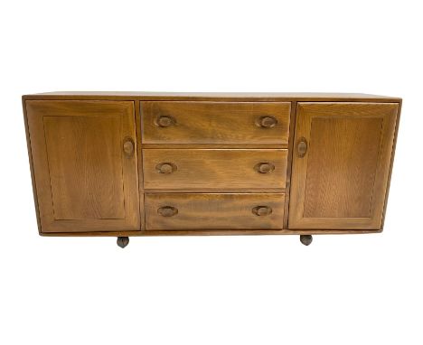 Ercol - elm sideboard, fitted with three drawers and two cupboardsDimensions: Height:&nbsp;69cm&nbsp; Length/Width:&nbsp;156c