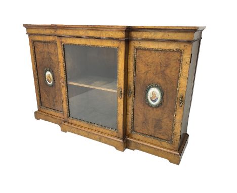 Victorian figured walnut break-front credenza, central glazed door flanked by two panelled doors with Sevres style portrait o