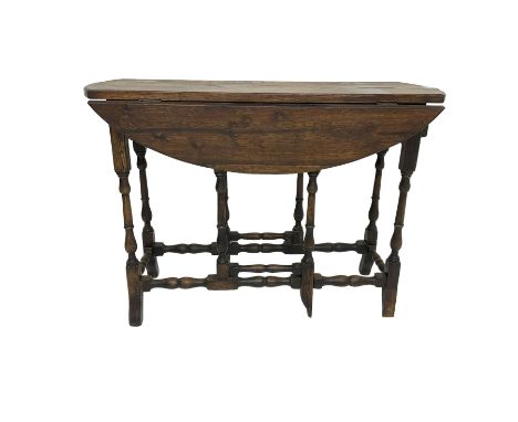17th century design oak oval drop leaf table, fitted with drawer to each end, gate-leg action base on turned supports with sh