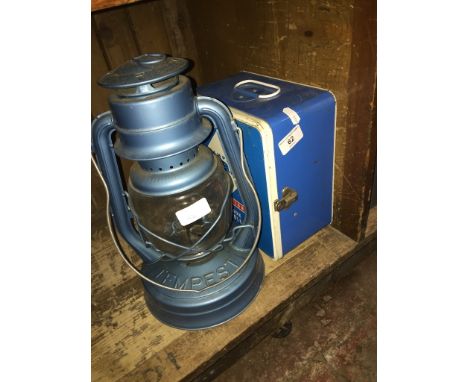 A camping gas stove and a Tempest lamp. 
