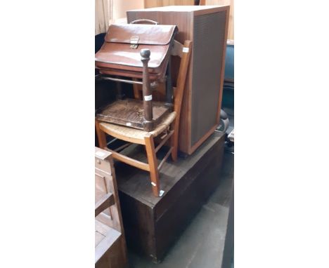 A cabinet record player and speaker.