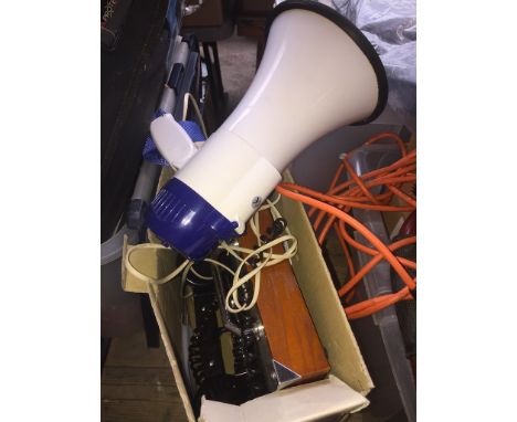 A classic field phone with instructions and a megaphone. 