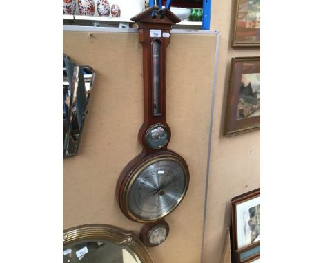 A barometer/thermometer by Howard Miller, lenght appx 96cm 
